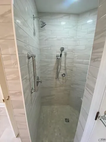 JDS Bath small walk in shower stationary showerhead and hand held showerhead richmond va