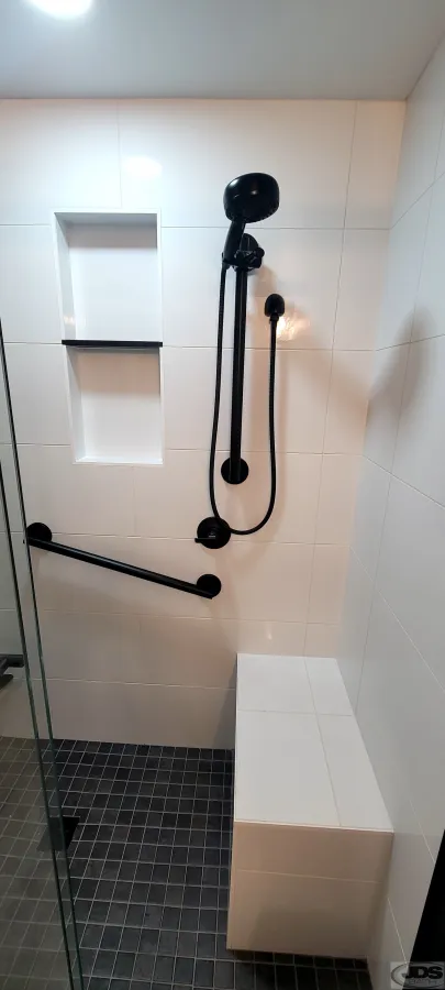 JDS Bath tile niche shower bench hand held showerhead on vertical bar matching black grab bar centeral va