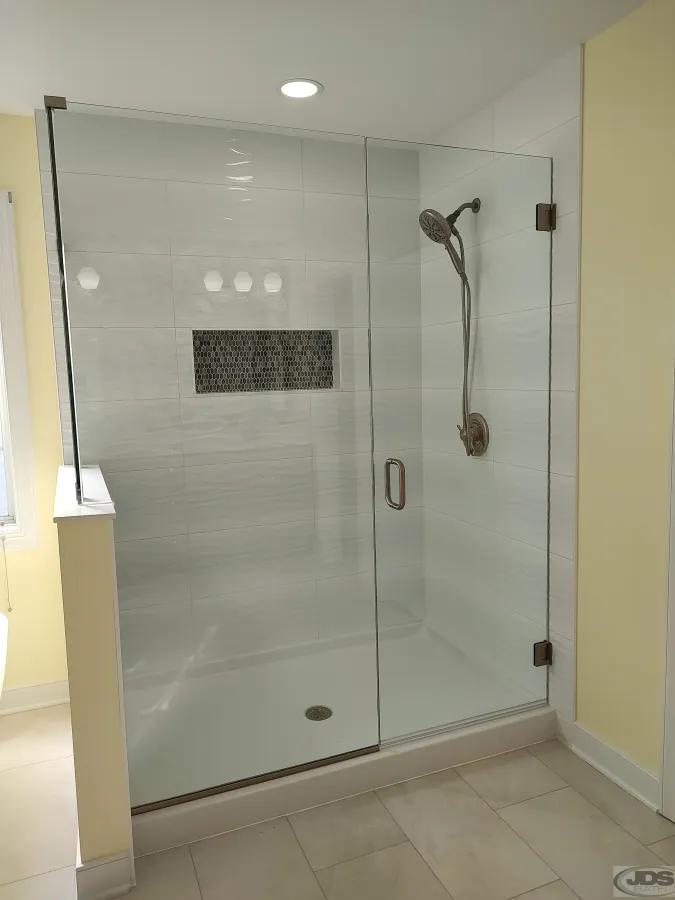 JDS Bath tile walk in shower frameless glass door panel hand held showerhead knee wall with frameless glass enclosure centeral va