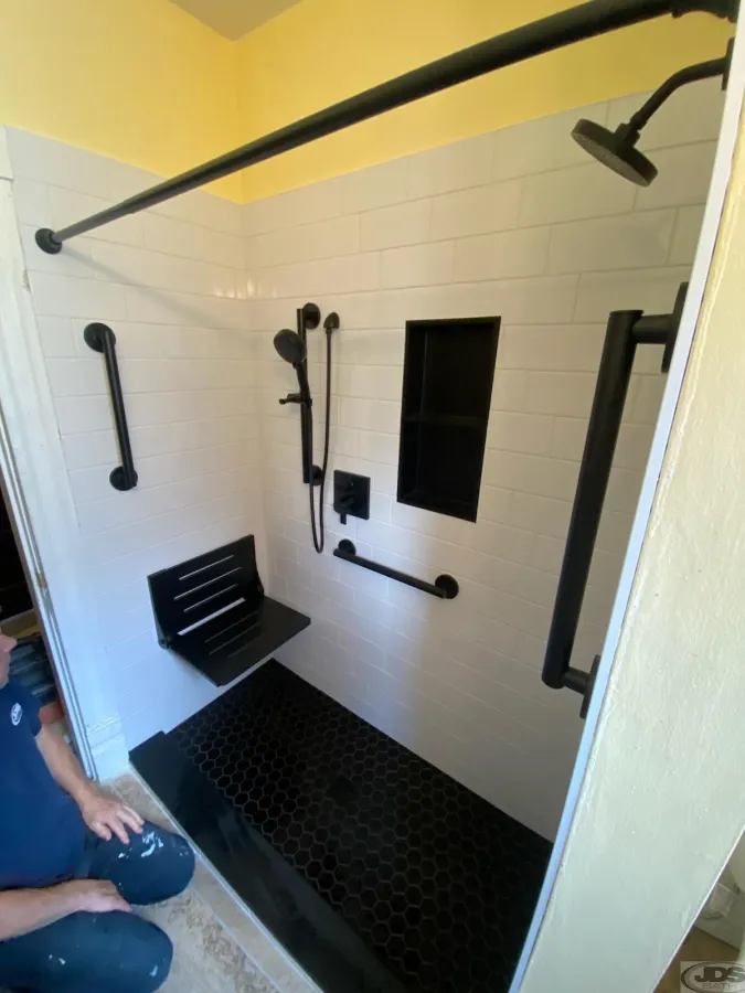JDS Bath white subway tile shower walls black tile floor black tile niche black folding bench richmond va