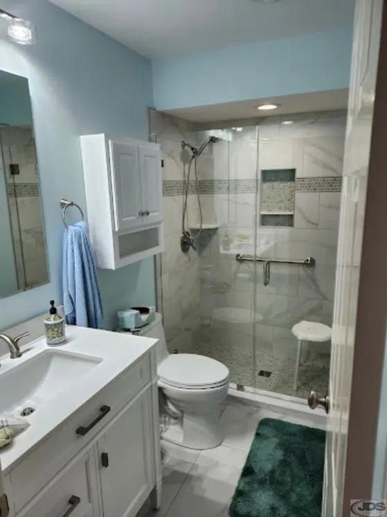 JDSBath complete remodel tile shower niche glass door panel vanity lighting richmond va