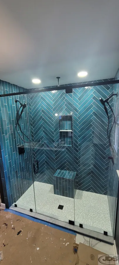 JDSBath herringbone blue tile shower glass semi frameless shower door double shower heads centeral va