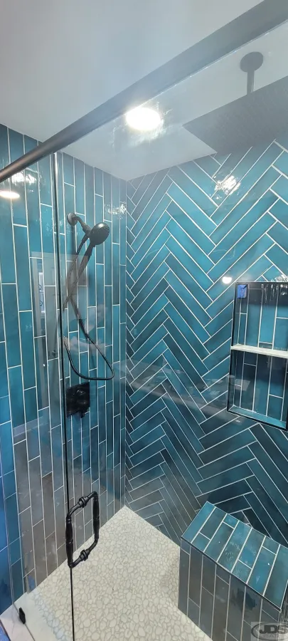 JDSBath herringbone tile shower hand held showerhead built in tile bench walk in shower centeral va