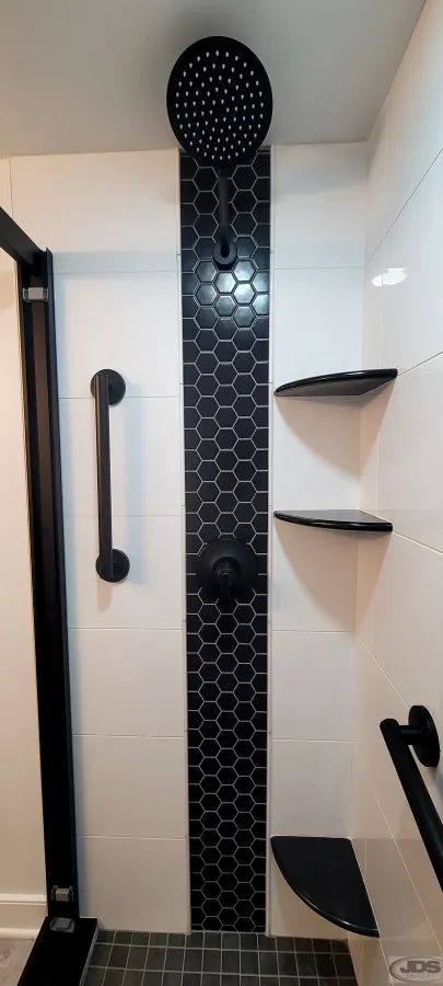 JDSBath tile shower black hexigon tile black fixtures white square tile and tile shower floor large showerhead centeral va