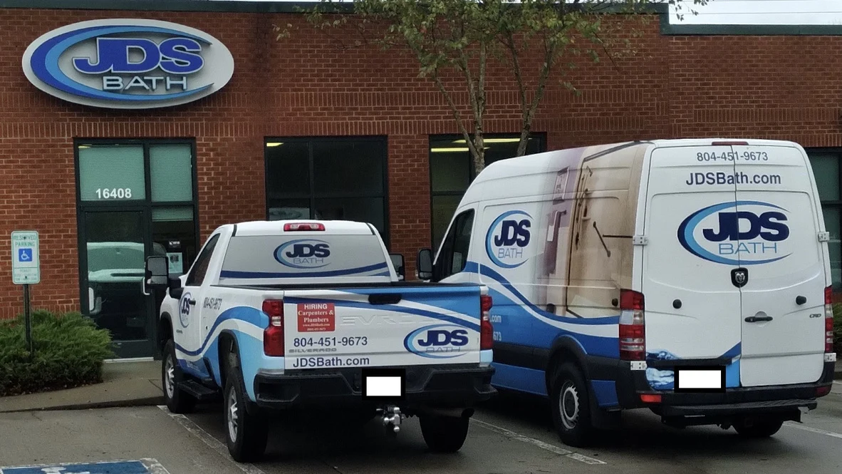 JDS Bath office front with bathroom remodeling trucks