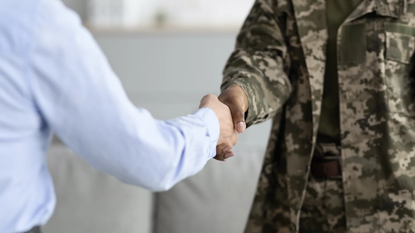 Close-up of handshake between veteran and bathroom remodeler