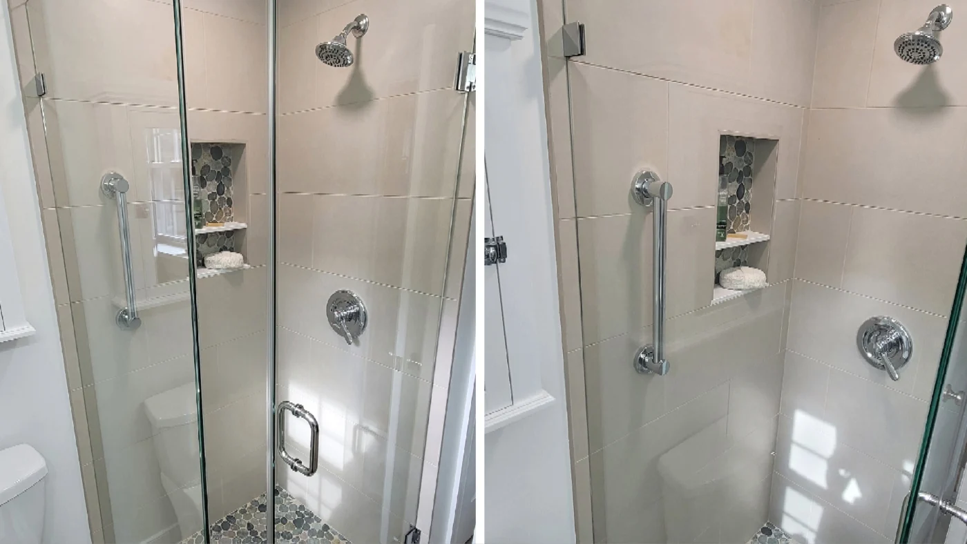 A tile walk-in shower with a glass door panel