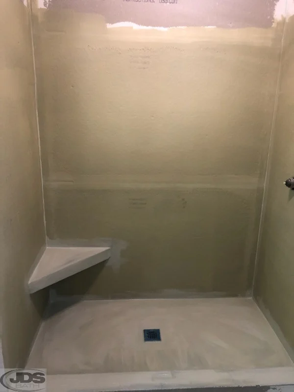 Shower floor and corner shelf after.