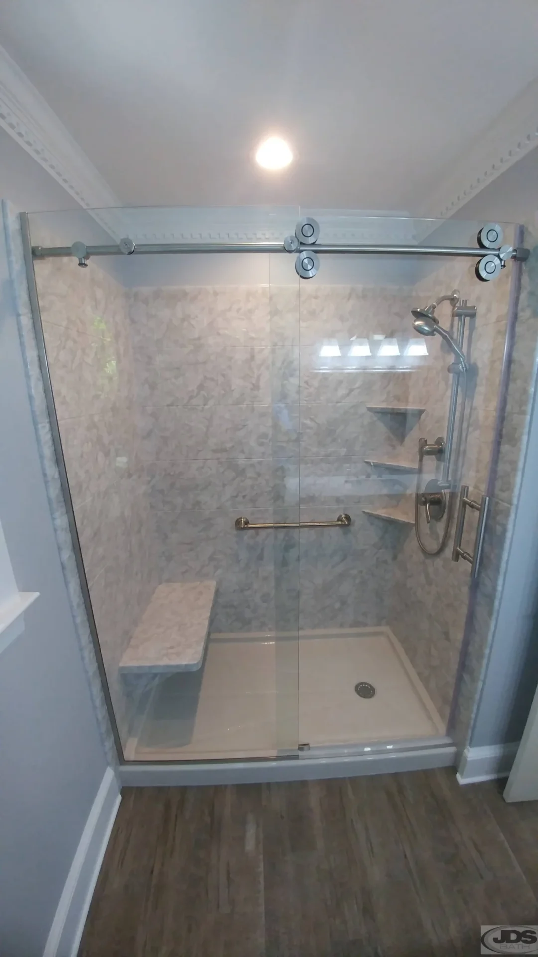 A barn style shower door with clear glass