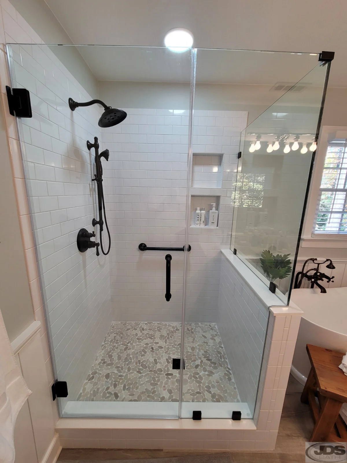 Frameless shower door and panel with knee wall