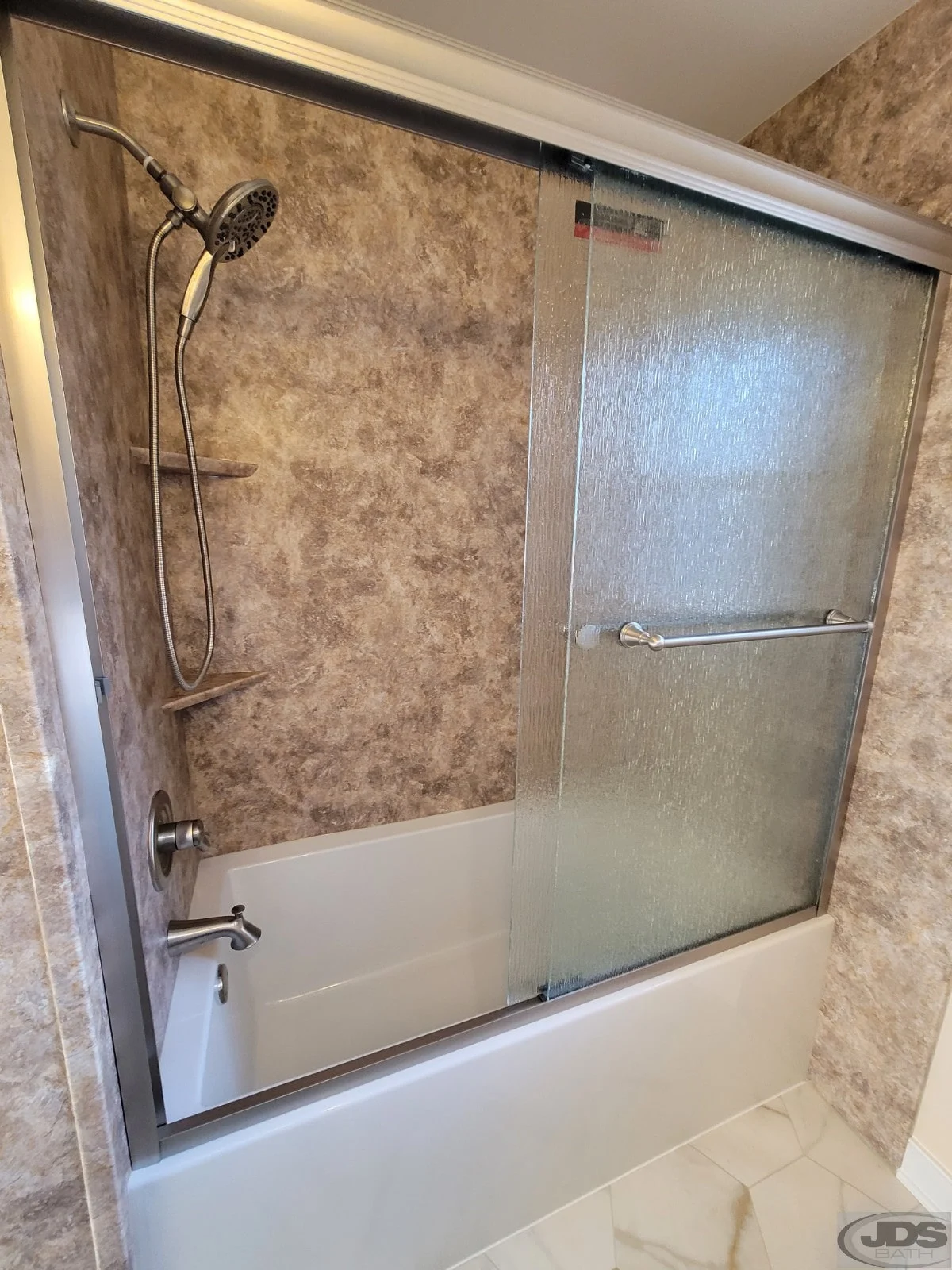 Frosted glass bathtub doors in a new bathroom remodel
