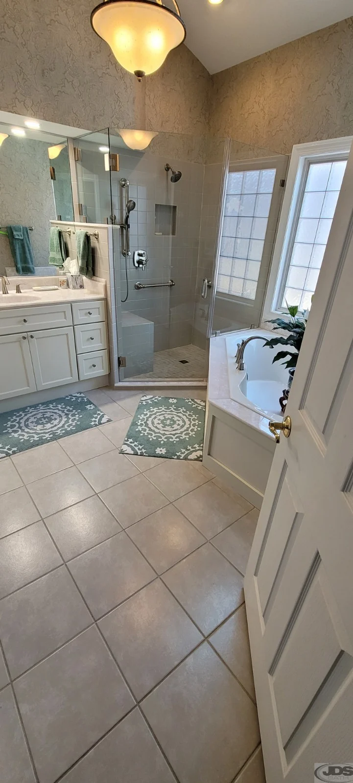 Brand new bathoom with new shower, floor, tub, and more