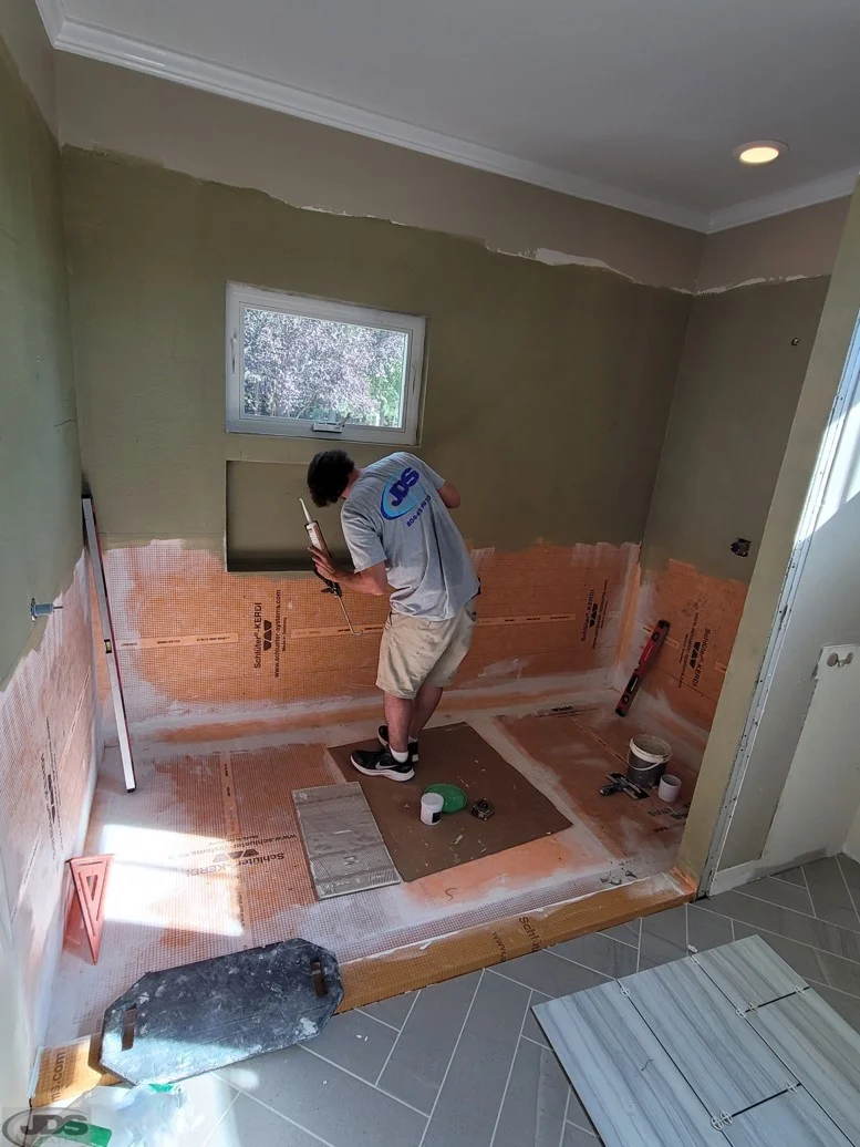 Remodeler guts the bathroom to the studs