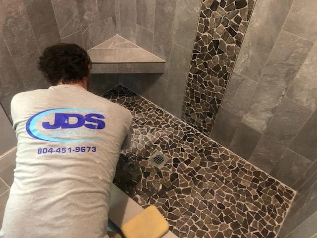 JDSBath-employee-putting-tile