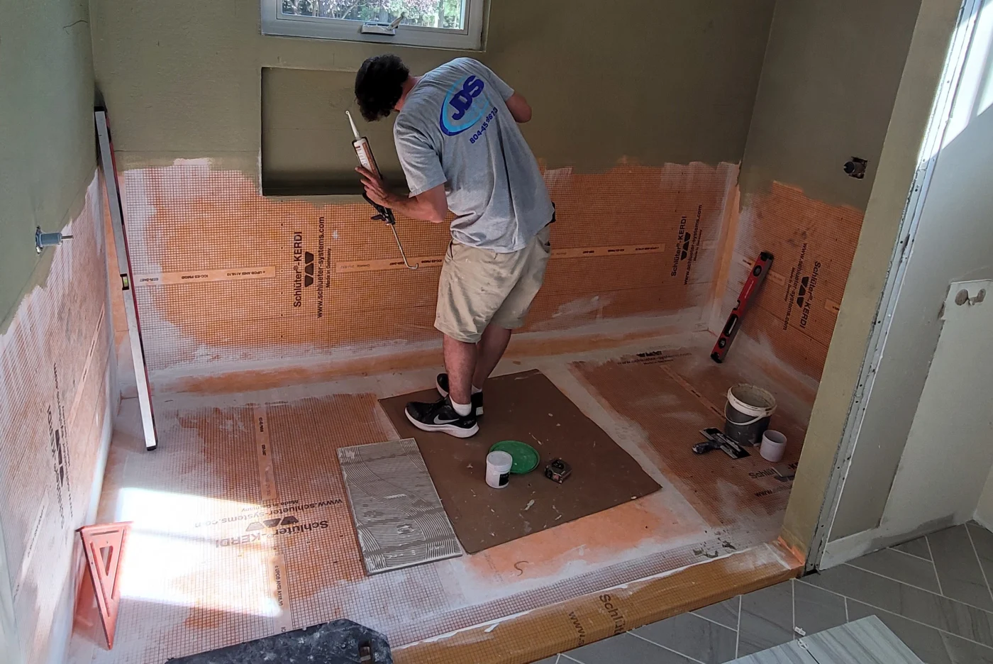 Bathroom remodel with custom tile shower and bird niche