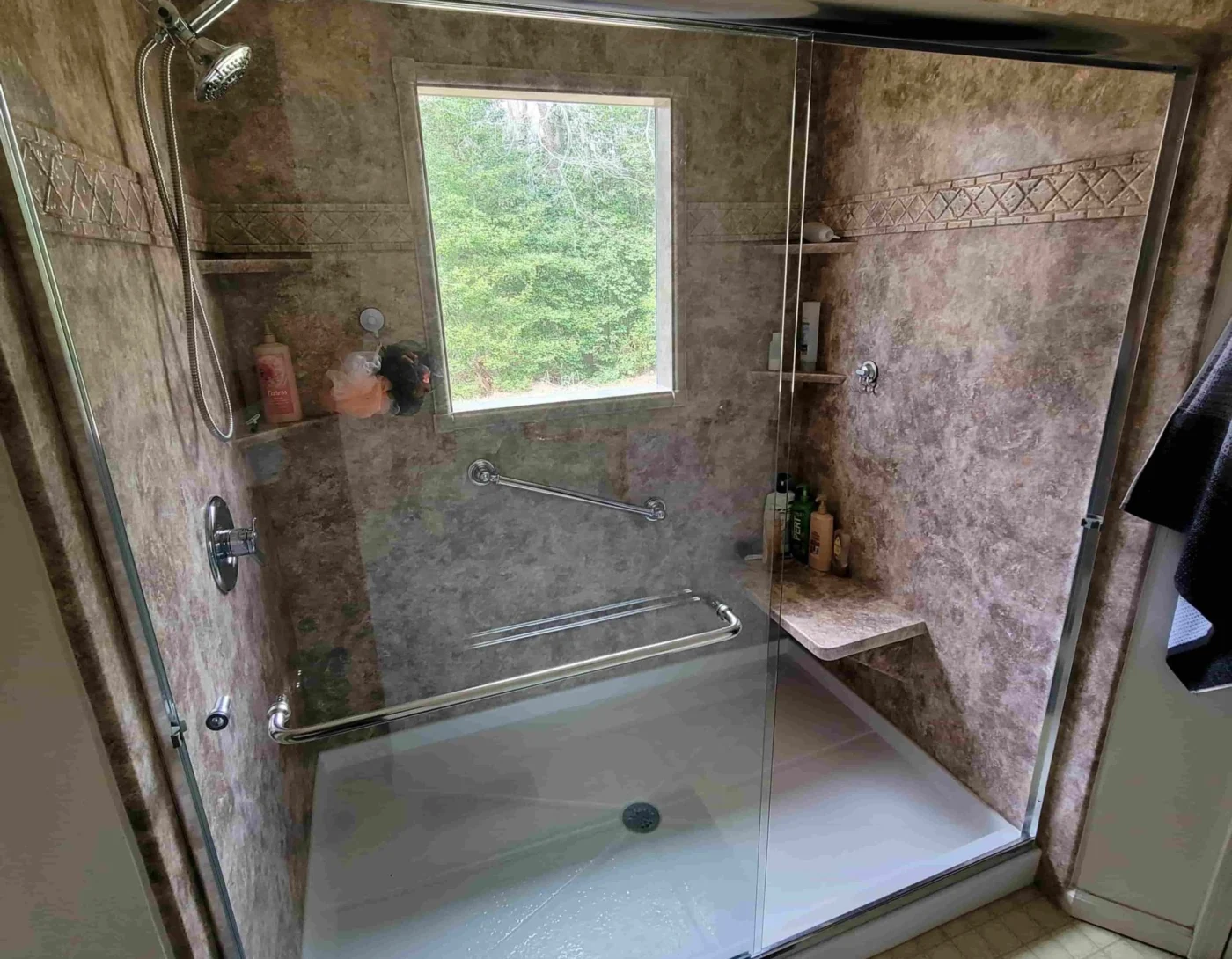 New shower with warm surround and glass door