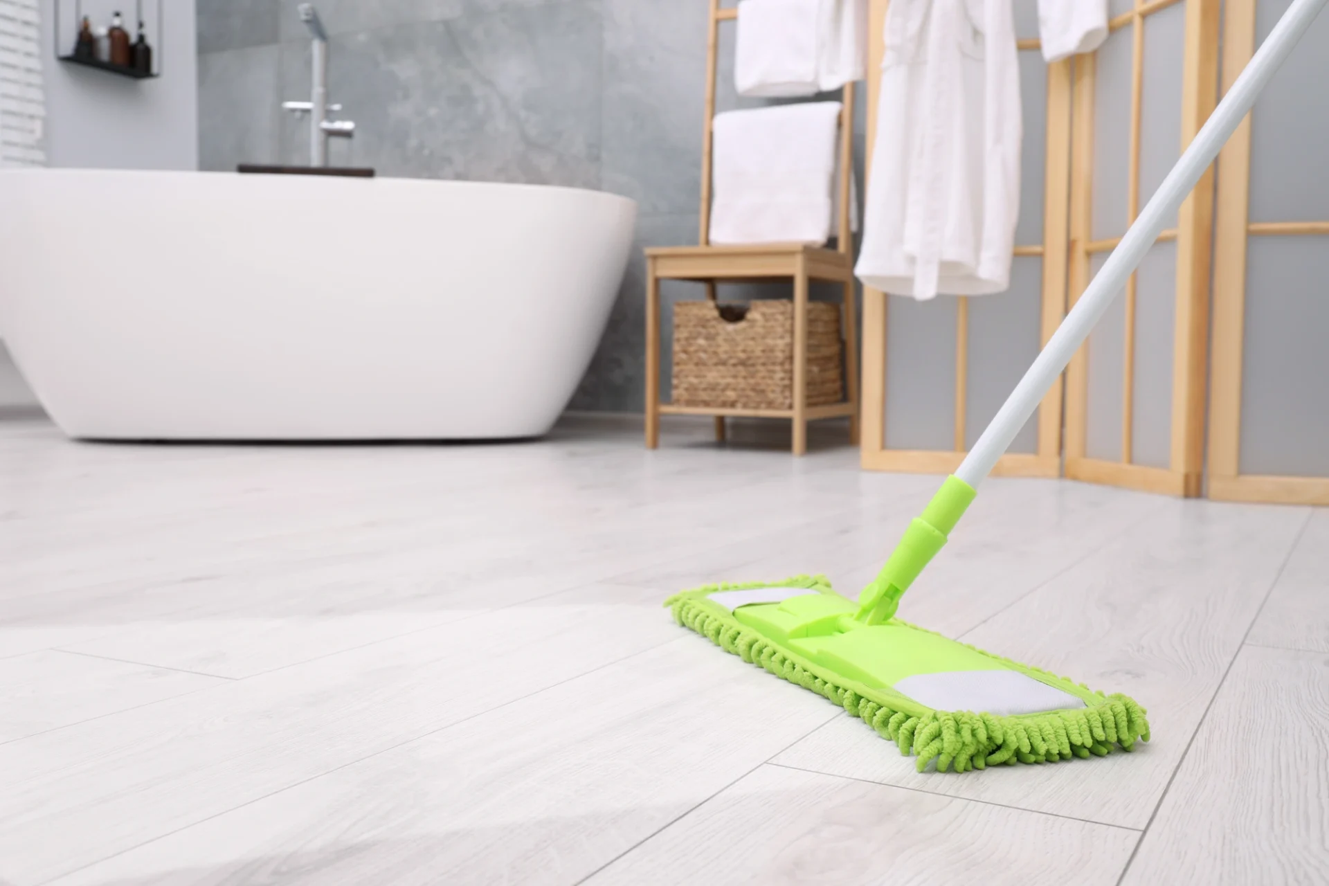 Sweeping a clean bathroom floor