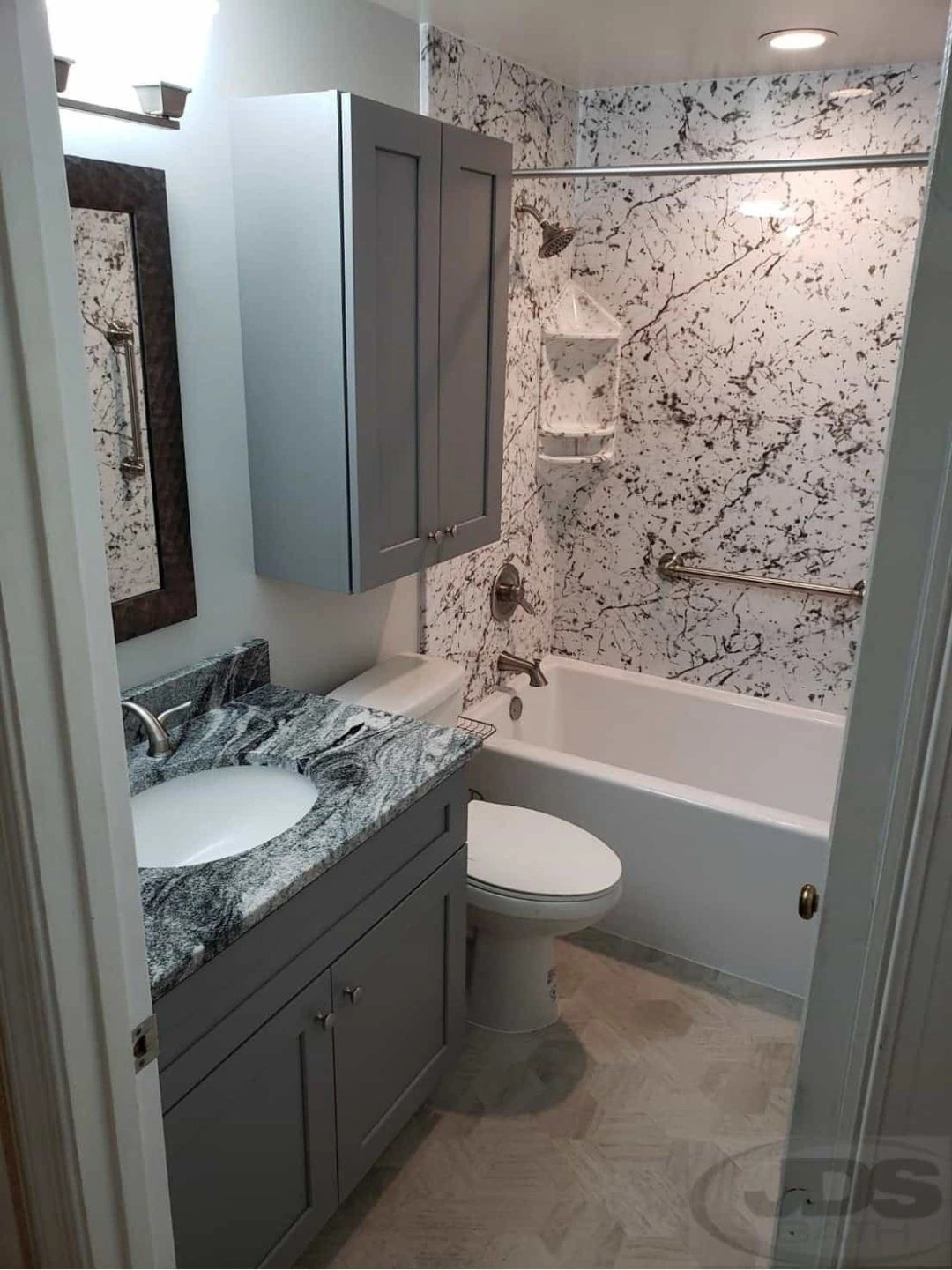 New sliding glass shower with brown tile walls
