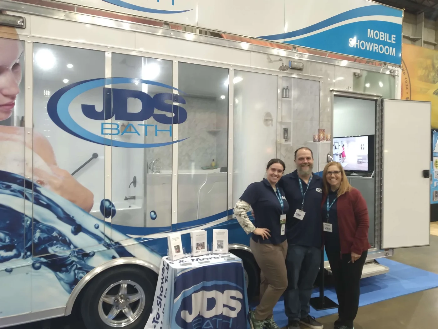 JDS Bath team standing in front of their mobile showroom.