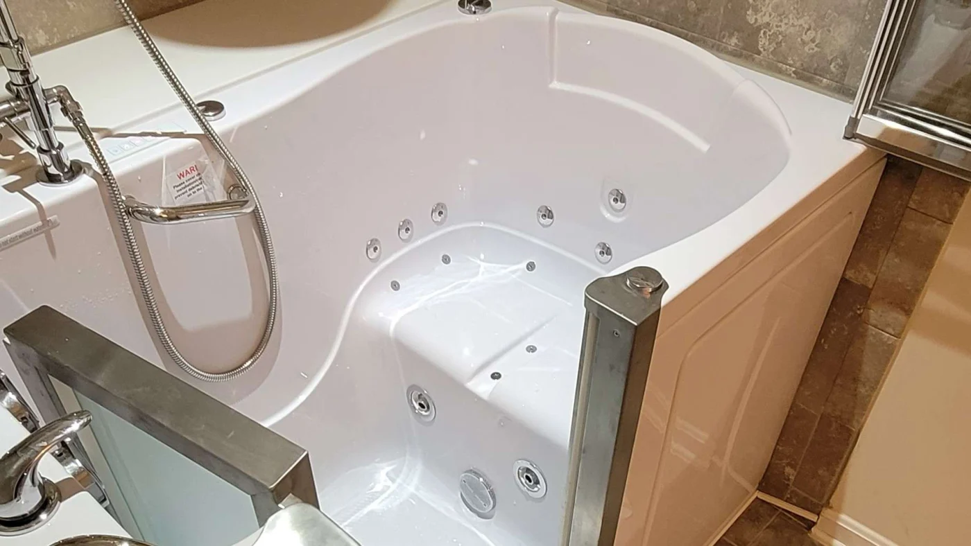 A white walk-in bathtub in a bathroom in Colonial Heights, VA by JDS Bath.