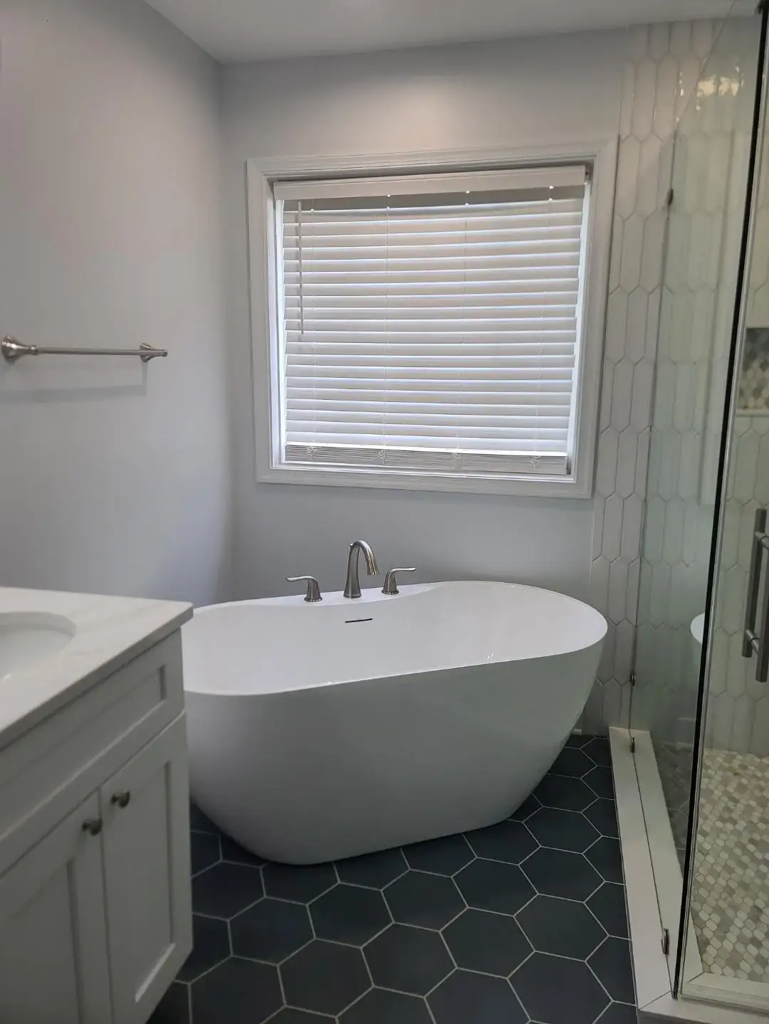 A gorgeous soaking tub installed in a bathroom for a wonderful, relaxing feel to the entire bathroom.